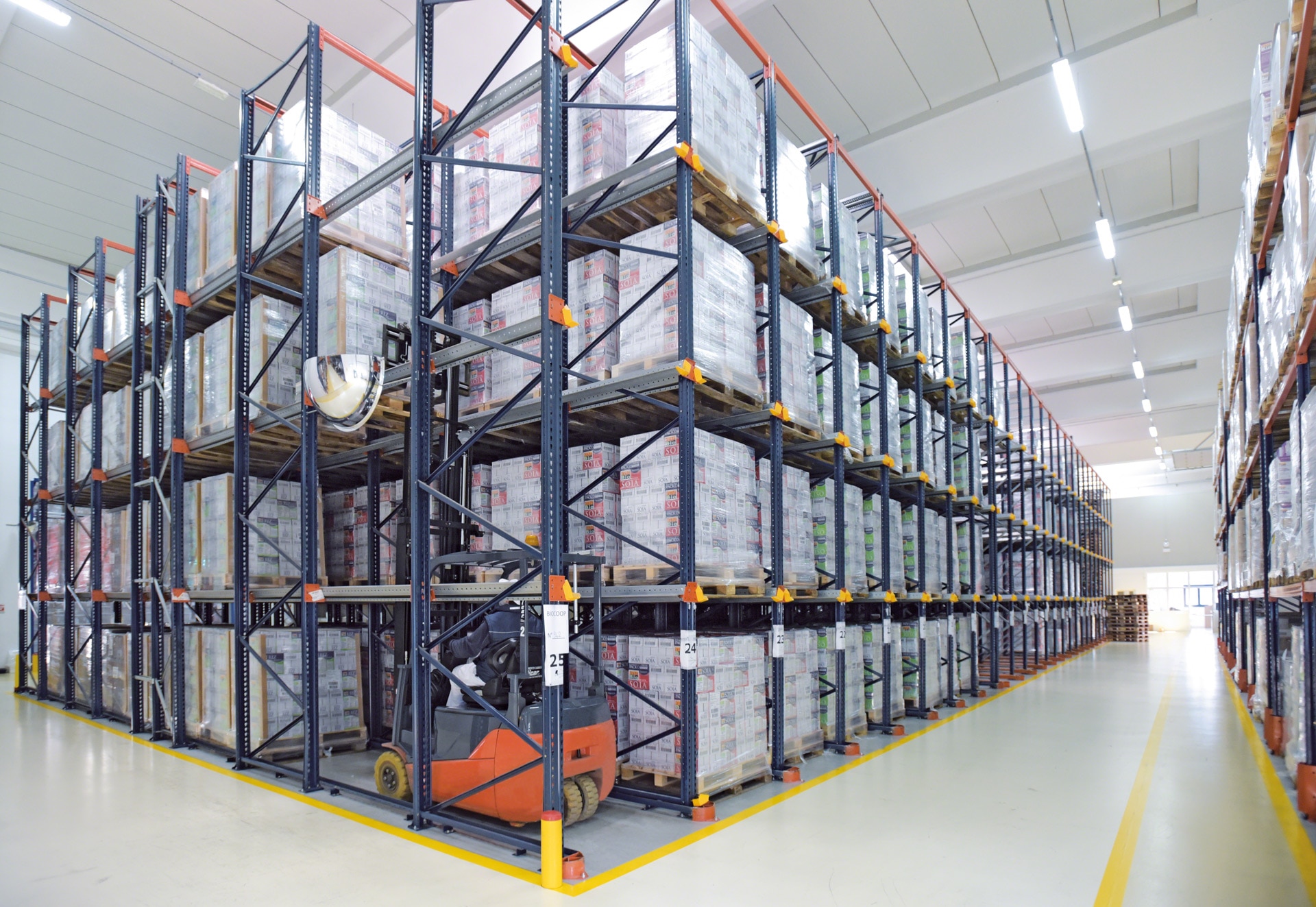 The forklift trucks run inside the drive-in storage lanes