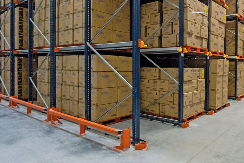 Upright footplates of the racks have side protectors to keep forklifts from damaging the rack structure